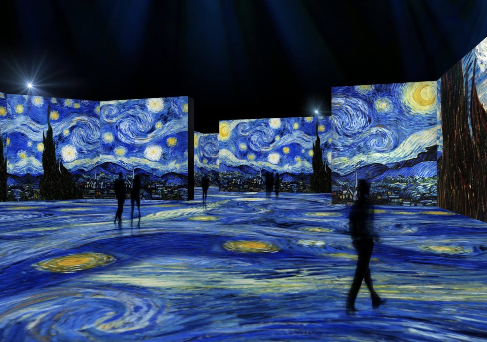 Visitors surrounded by starry-night projection in an immersive exhibition hall