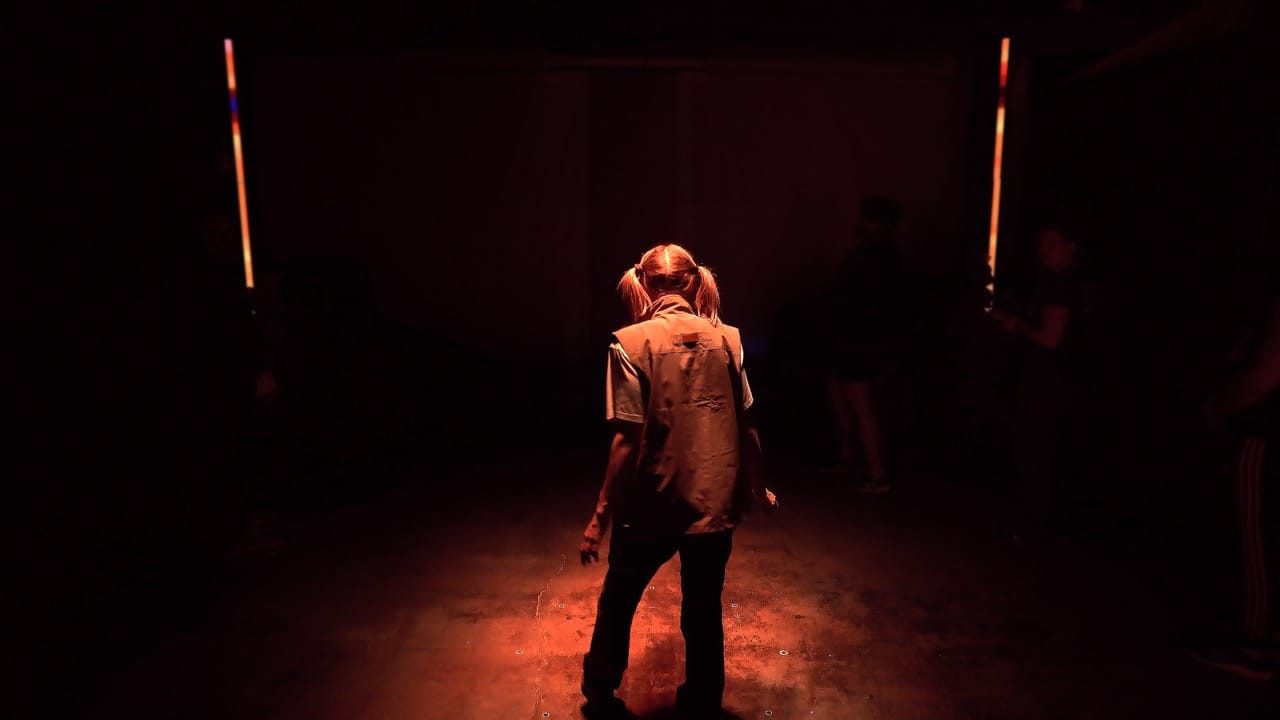 Audience inside a dim immersive story experience venue