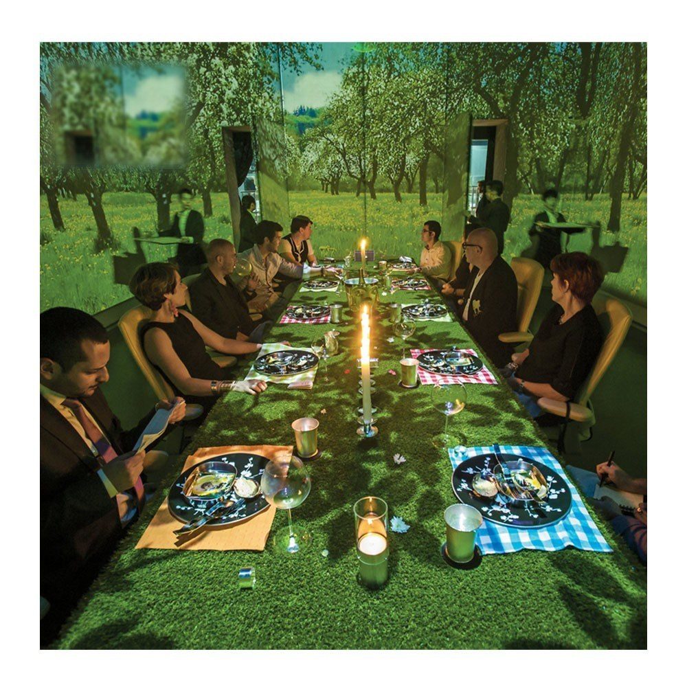 Themed projection dining table covered in forest light and shadow
