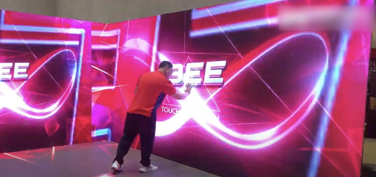 Touch-triggered light effects on an interactive wall at a mall flow node